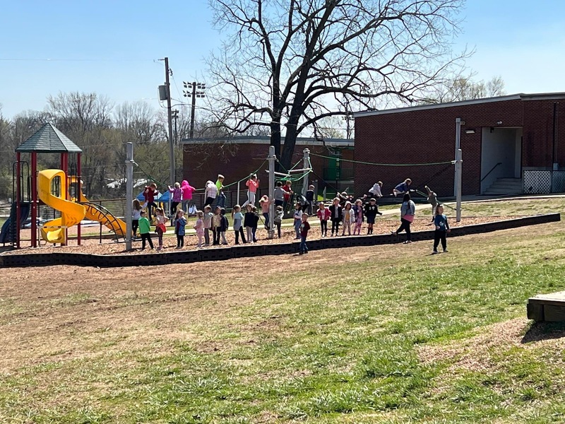 Elementary Students Playing on new playground equipment
