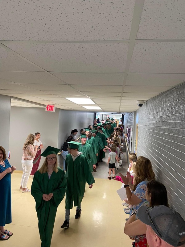 Graduating Seniors walking through Elementary